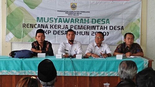 A village planning meeting with local government