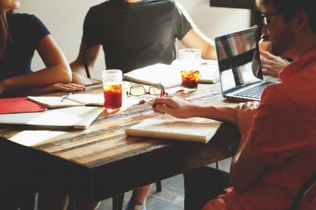 A company team working together at a table